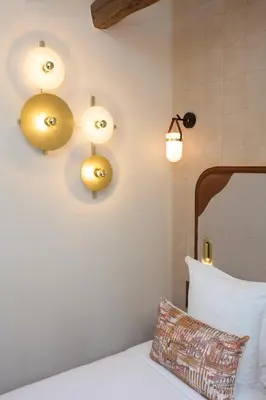 Un ou plusieurs lits dans un hébergement de l'établissement Hôtel Hiro Paris