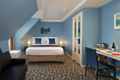 Un ou plusieurs lits dans un hébergement de l'établissement Grand Hôtel Malher