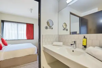 Un ou plusieurs lits dans un hébergement de l'établissement Appart'hôtel Odalys City - Paris XVII