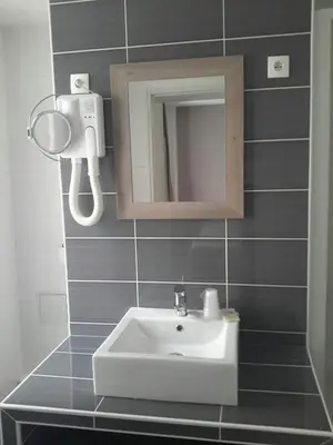 Salle de bains dans l'établissement Hotel Cosmos