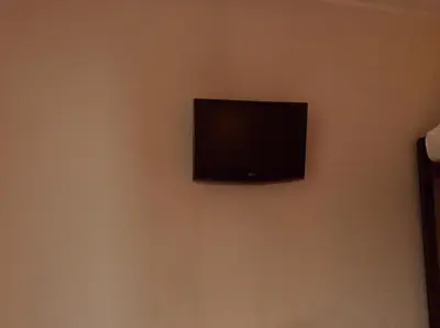 Télévision ou salle de divertissement dans l'établissement Hotel De La Place
