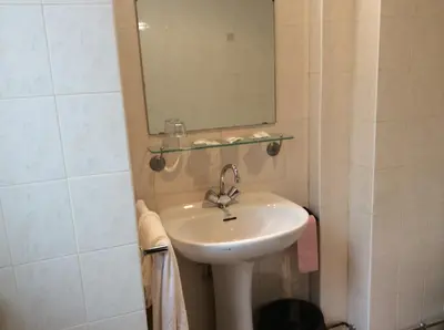 Salle de bains dans l'établissement Hotel De La Place