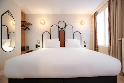 Un ou plusieurs lits dans un hébergement de l'établissement Hôtel de L'Esperance