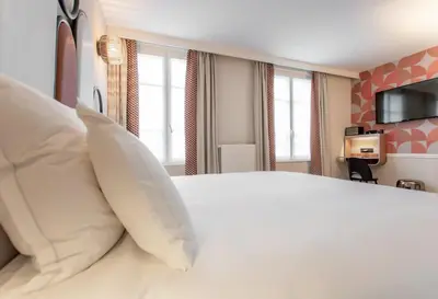 Un ou plusieurs lits dans un hébergement de l'établissement Hôtel de L'Esperance