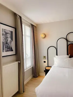 Un ou plusieurs lits dans un hébergement de l'établissement Hôtel de L'Esperance