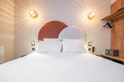 Un ou plusieurs lits dans un hébergement de l'établissement Hôtel de L'Esperance