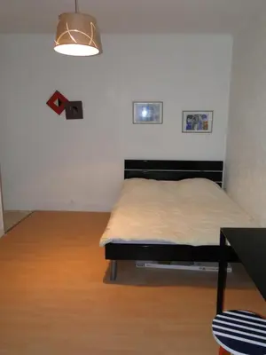 Un ou plusieurs lits dans un hébergement de l'établissement Appartement ENTRE TROCADERO et CHAMPS ELYSES