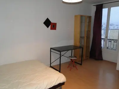 Un ou plusieurs lits dans un hébergement de l'établissement Appartement ENTRE TROCADERO et CHAMPS ELYSES
