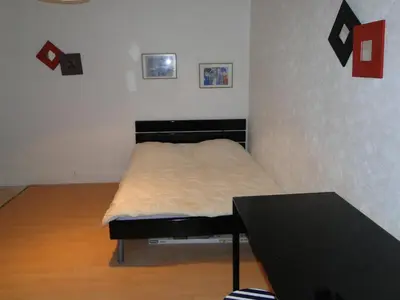 Un ou plusieurs lits dans un hébergement de l'établissement Appartement ENTRE TROCADERO et CHAMPS ELYSES
