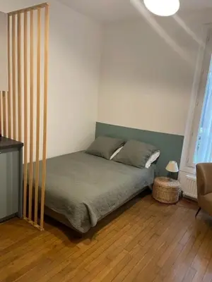 Un ou plusieurs lits dans un hébergement de l'établissement Studio Paris tour Eiffel