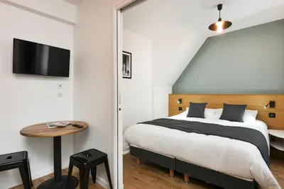 Un ou plusieurs lits dans un hébergement de l'établissement Hotel Résidence Montebello