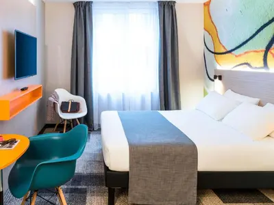 Un ou plusieurs lits dans un hébergement de l'établissement ibis Styles Clamart Gare Grand Paris
