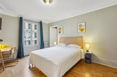 Un ou plusieurs lits dans un hébergement de l'établissement Hôtel Juliette