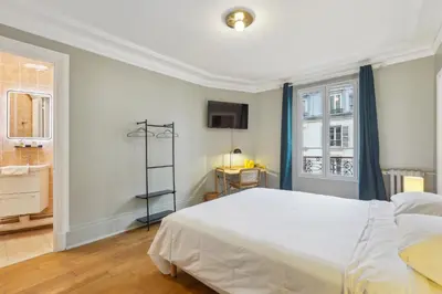 Un ou plusieurs lits dans un hébergement de l'établissement Hôtel Juliette