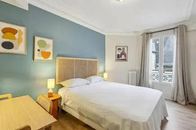 Un ou plusieurs lits dans un hébergement de l'établissement Hôtel Juliette