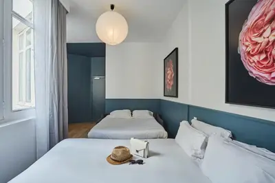 Un ou plusieurs lits dans un hébergement de l'établissement Hôtel Beauquartier Montmartre