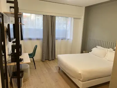 Un ou plusieurs lits dans un hébergement de l'établissement Hôtel Beauquartier Montmartre