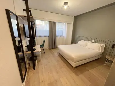 Un ou plusieurs lits dans un hébergement de l'établissement Hôtel Beauquartier Montmartre