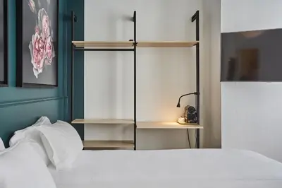 Un ou plusieurs lits dans un hébergement de l'établissement Hôtel Beauquartier Montmartre