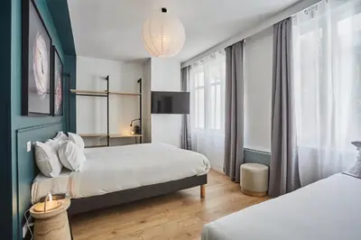 Un ou plusieurs lits dans un hébergement de l'établissement Hôtel Beauquartier Montmartre