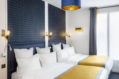 Un ou plusieurs lits dans un hébergement de l'établissement Hôtel Clarisse