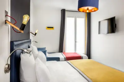 Un ou plusieurs lits dans un hébergement de l'établissement Hôtel Clarisse
