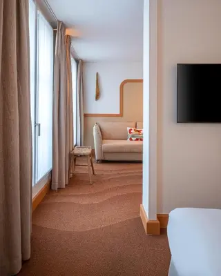 Un ou plusieurs lits dans un hébergement de l'établissement Hôtel Le Monna Lisa by Inwood Hotels