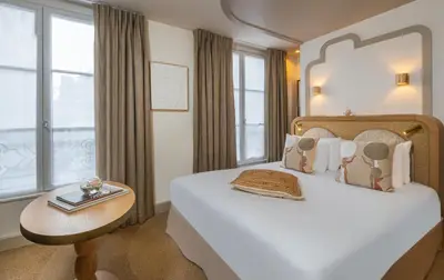 Un ou plusieurs lits dans un hébergement de l'établissement Hôtel Le Monna Lisa by Inwood Hotels