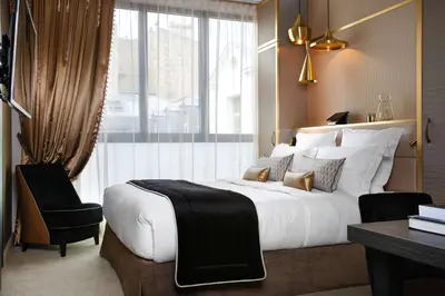 Un ou plusieurs lits dans un hébergement de l'établissement Niepce Paris, Curio Collection By Hilton