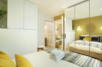 Un ou plusieurs lits dans un hébergement de l'établissement Rent a Room - Residence Blanche