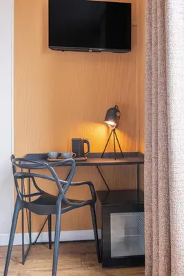 Télévision ou salle de divertissement dans l'établissement Hôtel Coypel by Magna Arbor