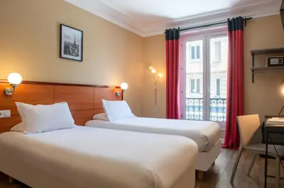 Un ou plusieurs lits dans un hébergement de l'établissement Hôtel Coypel by Magna Arbor