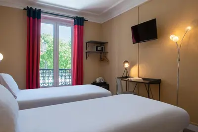 Un ou plusieurs lits dans un hébergement de l'établissement Hôtel Coypel by Magna Arbor