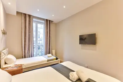 Un ou plusieurs lits dans un hébergement de l'établissement 57-LUXURY PARISIEN HOME SEBASTOPOL 1 (2G)