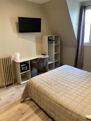 Télévision ou salle de divertissement dans l'établissement Angleterre Hotel