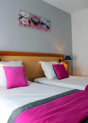 Un ou plusieurs lits dans un hébergement de l'établissement Hotel du Chemin Vert