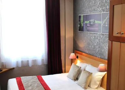 Un ou plusieurs lits dans un hébergement de l'établissement Hotel du Chemin Vert