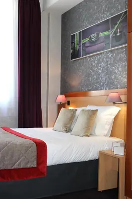 Un ou plusieurs lits dans un hébergement de l'établissement Hotel du Chemin Vert