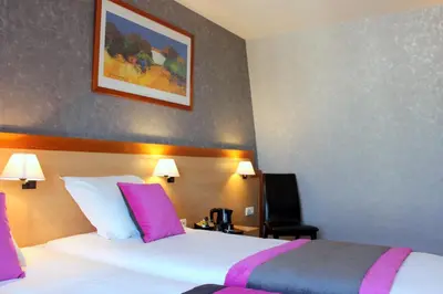 Un ou plusieurs lits dans un hébergement de l'établissement Hotel du Chemin Vert