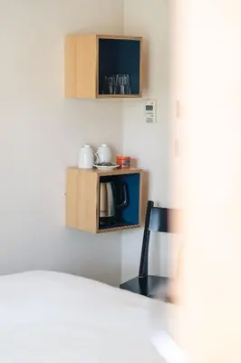 Un ou plusieurs lits dans un hébergement de l'établissement Le Citizen Hôtel