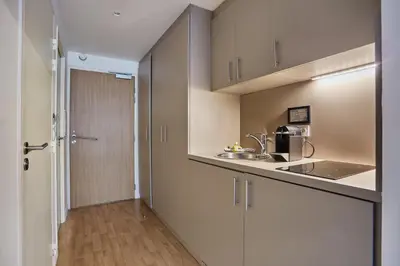 Cuisine ou kitchenette dans l'établissement Appart'hôtel Odalys City - Paris Montmartre