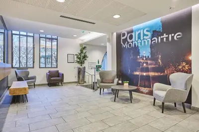 Coin salon dans l'établissement Appart'hôtel Odalys City - Paris Montmartre