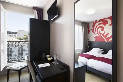 Un ou plusieurs lits dans un hébergement de l'établissement Hotel Bastille Secret
