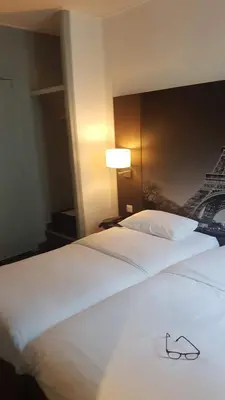 Un ou plusieurs lits dans un hébergement de l'établissement Hotel Victoria