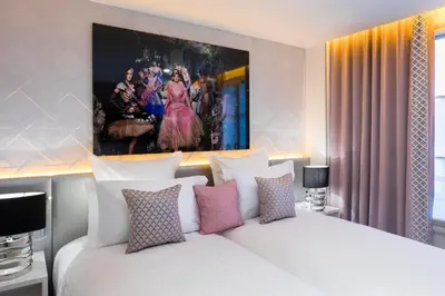 Un ou plusieurs lits dans un hébergement de l'établissement Hôtel Dress Code