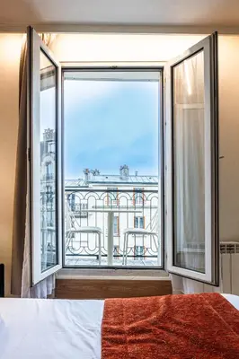Un ou plusieurs lits dans un hébergement de l'établissement Hôtel De Venise