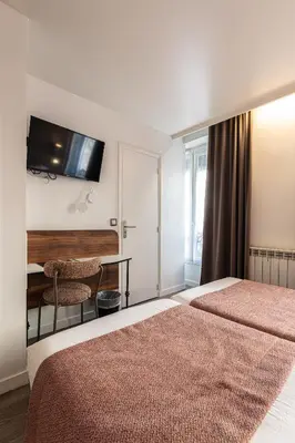 Un ou plusieurs lits dans un hébergement de l'établissement Hôtel De Venise