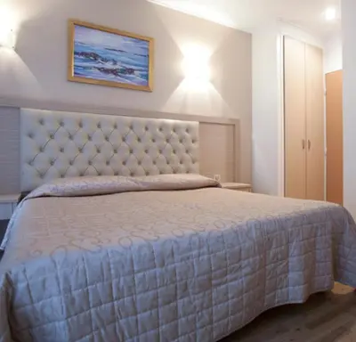Un ou plusieurs lits dans un hébergement de l'établissement Hôtel Lebron
