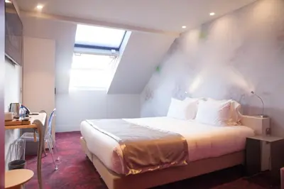 Un ou plusieurs lits dans un hébergement de l'établissement Hotel Sixteen Paris Montrouge