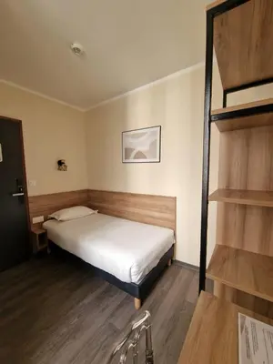 Un ou plusieurs lits dans un hébergement de l'établissement Hôtel D'Anjou